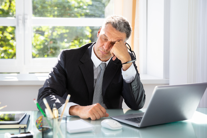 Businessman Sleeping In Office