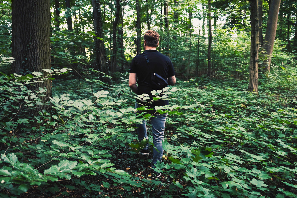 man hiking in forest
