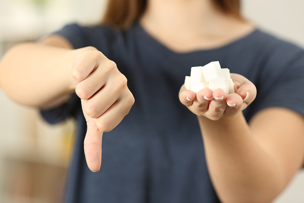 sugar cubes and thumbs down